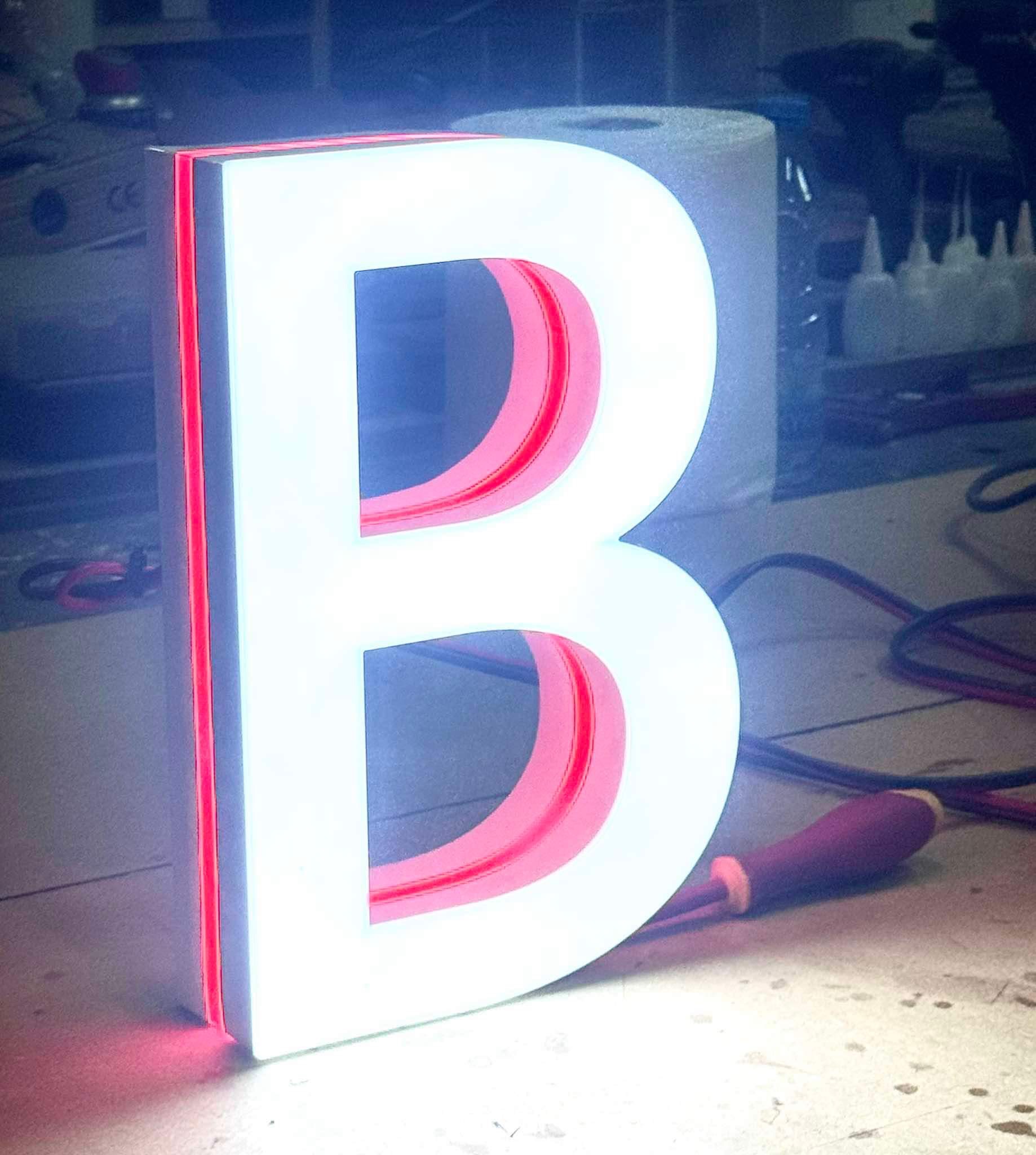 3D illuminated letter B with red and white lighting