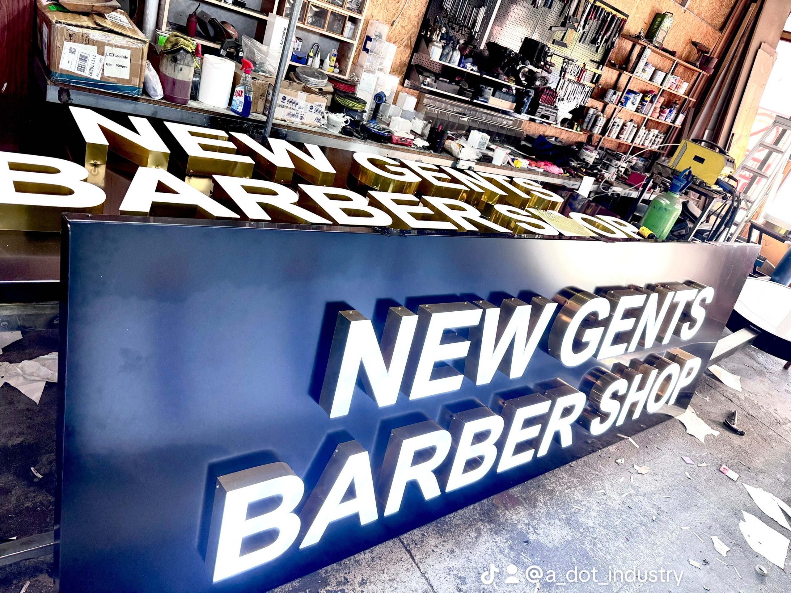 3D letters sign for barber shop with front lit golden mirror sides in Larnaca.